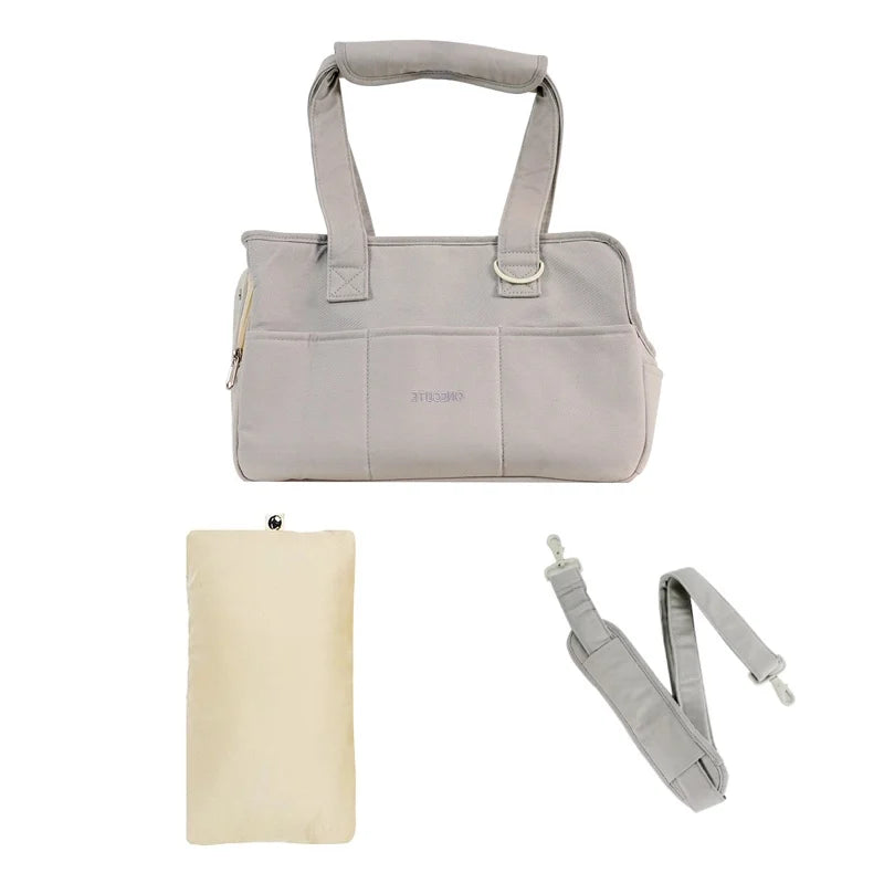FanzyMarket portable cotton pet sling carrier for small dogs and cats, showing shoulder bag design in medium size with comfortable straps.
