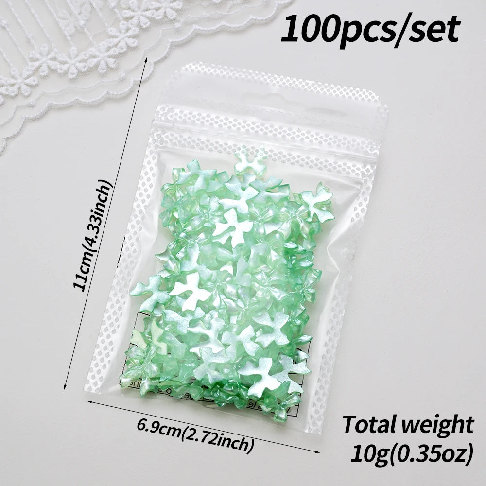 100-Pack 3D Pink Pearlescent Resin Bow Nail Charms — Flat Back Bowknot Nail Art Decorations for DIY Manicure