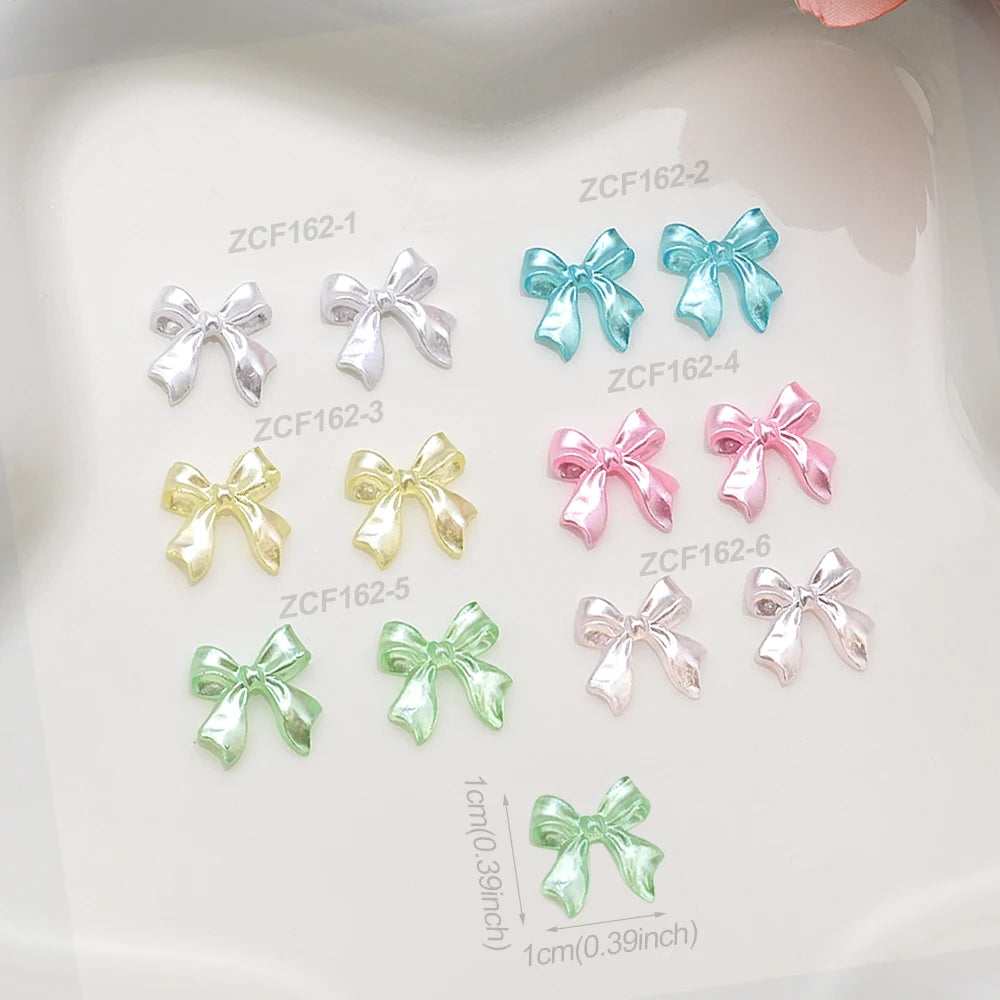 100-Pack 3D Pink Pearlescent Resin Bow Nail Charms — Flat Back Bowknot Nail Art Decorations for DIY Manicure
