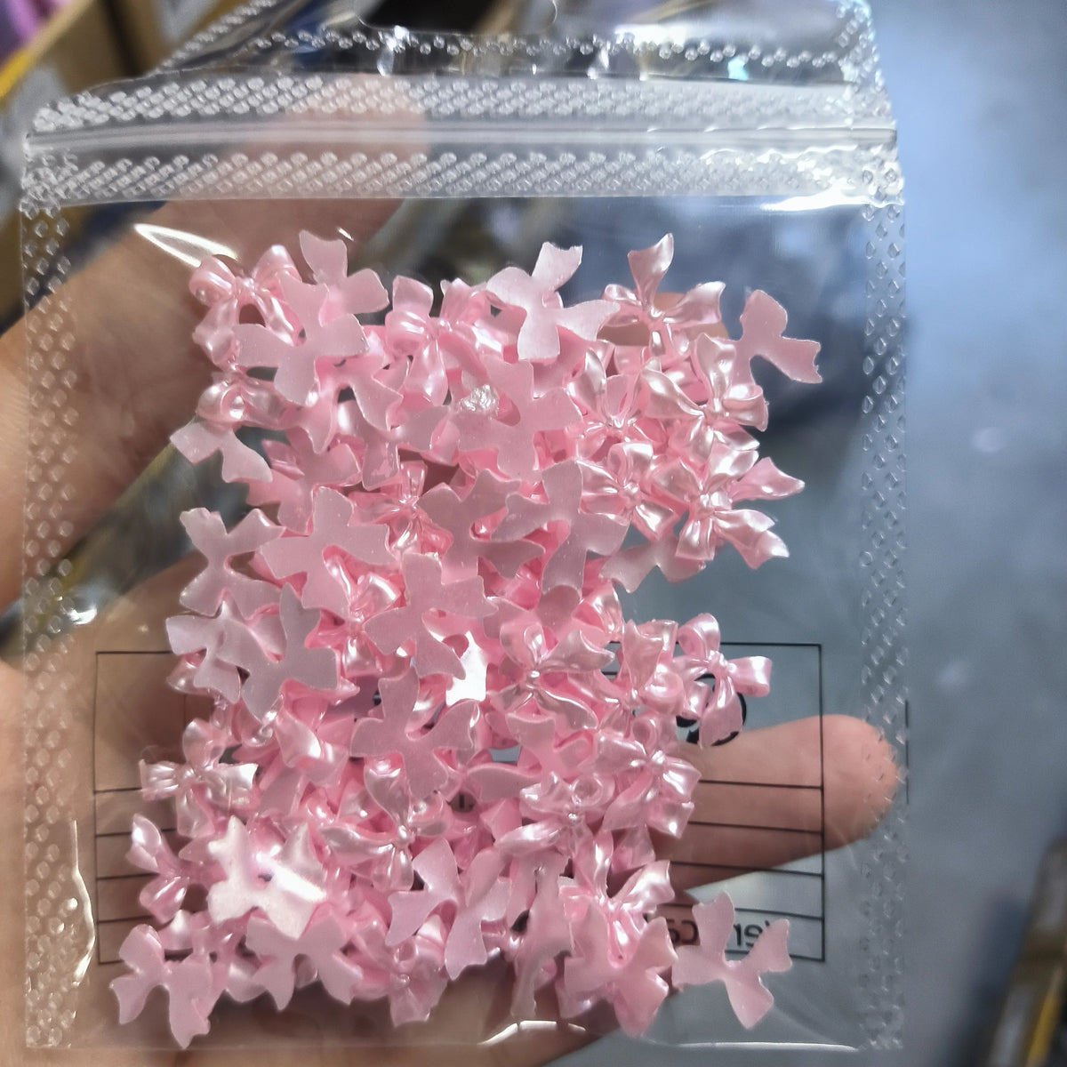 100-Pack 3D Pink Pearlescent Resin Bow Nail Charms — Flat Back Bowknot Nail Art Decorations for DIY Manicure