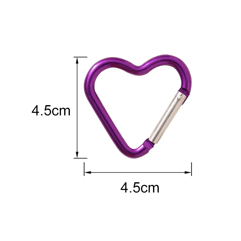 Silver heart-shaped aluminum carabiner keychain clip for keys, water bottles, and bags, ideal for travel and accessories.