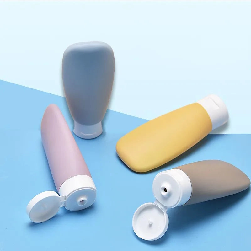 FanzyMarket refillable travel bottles set with four 60ml leakproof containers for shampoo, lotion, and cosmetics.
