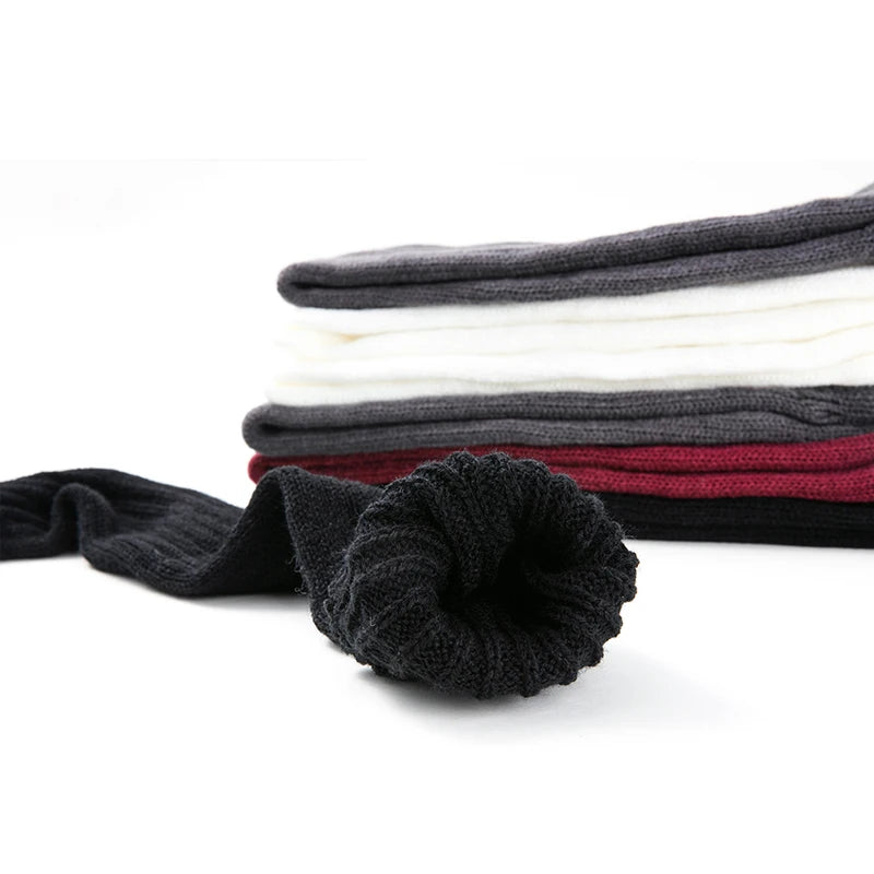 Black women's over-the-knee knit leg warmers with open heel, footless design, available in 27 and 36 inches, soft winter gaiters.