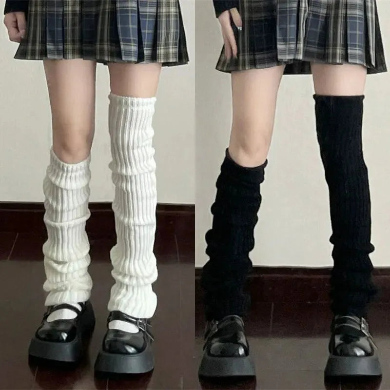 Pair of black and white Y2K knit leg warmers with crochet design, 50cm length, by FanzyMarket, styled as boot cuffs for women.