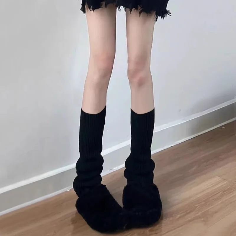 Pair of black and white Y2K knit leg warmers with crochet boot cuffs, 50cm length, worn on legs for stylish winter accessories.