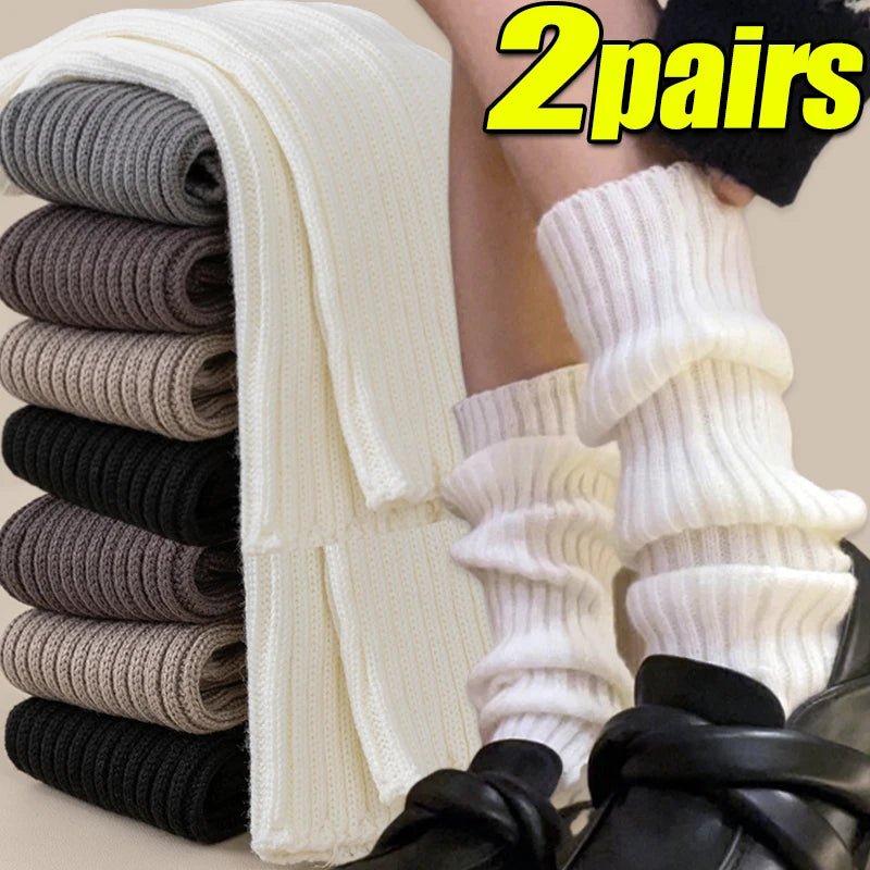White and black Y2K fluffy knit leg warmers and arm covers for women, Gothic Lolita style, available in various lengths.