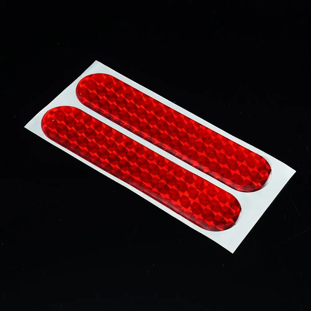 Two red reflective car door safety stickers from FanzyMarket, interior warning tape, 10.6 x 2.3 cm, for auto and moto security.