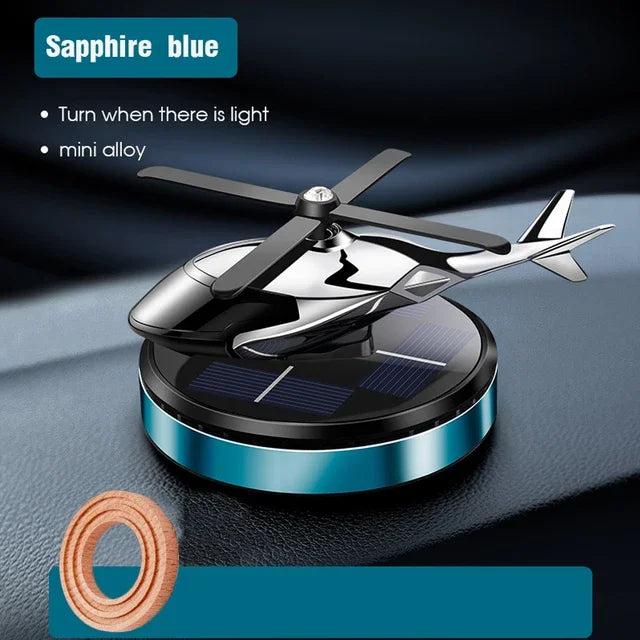 FanzyMarket solar helicopter propeller car air freshener and aromatherapy diffuser mounted inside a vehicle interior.