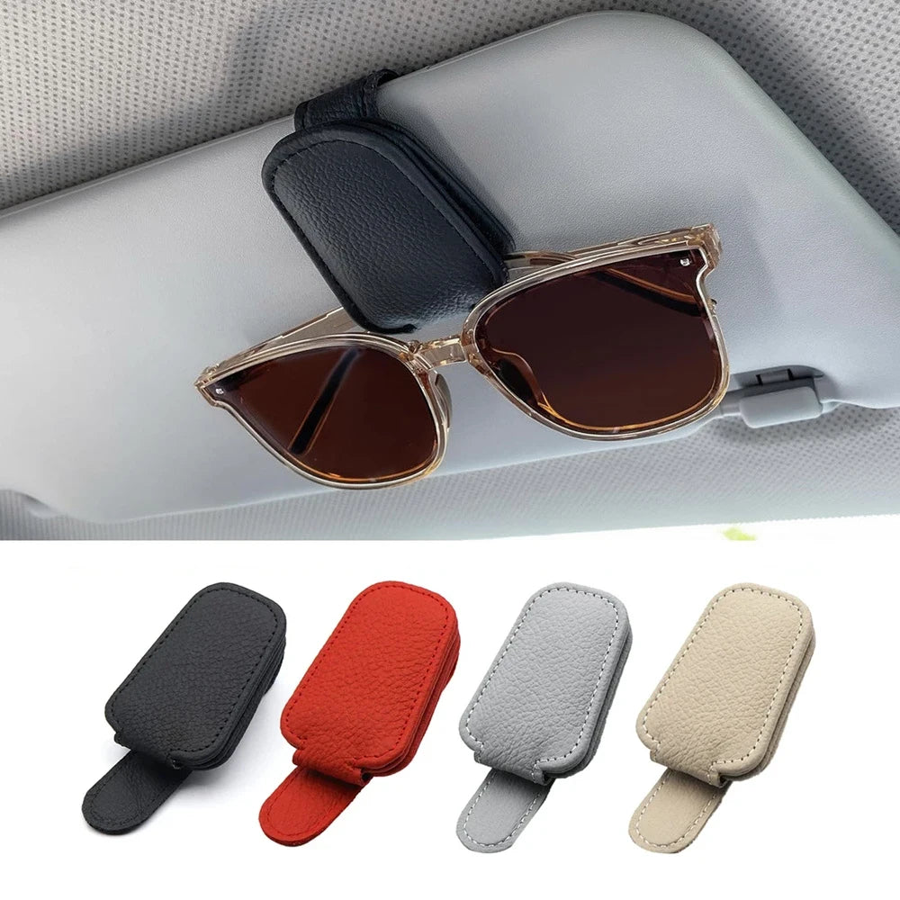 FanzyMarket magnetic car sunglasses holder on beige leather sun visor, holds glasses and cards securely in auto interior.