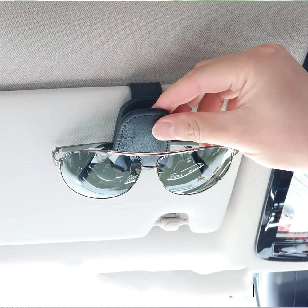 Beige universal magnetic car sunglasses holder with foldable leather sun visor clip, designed for glasses and card storage.