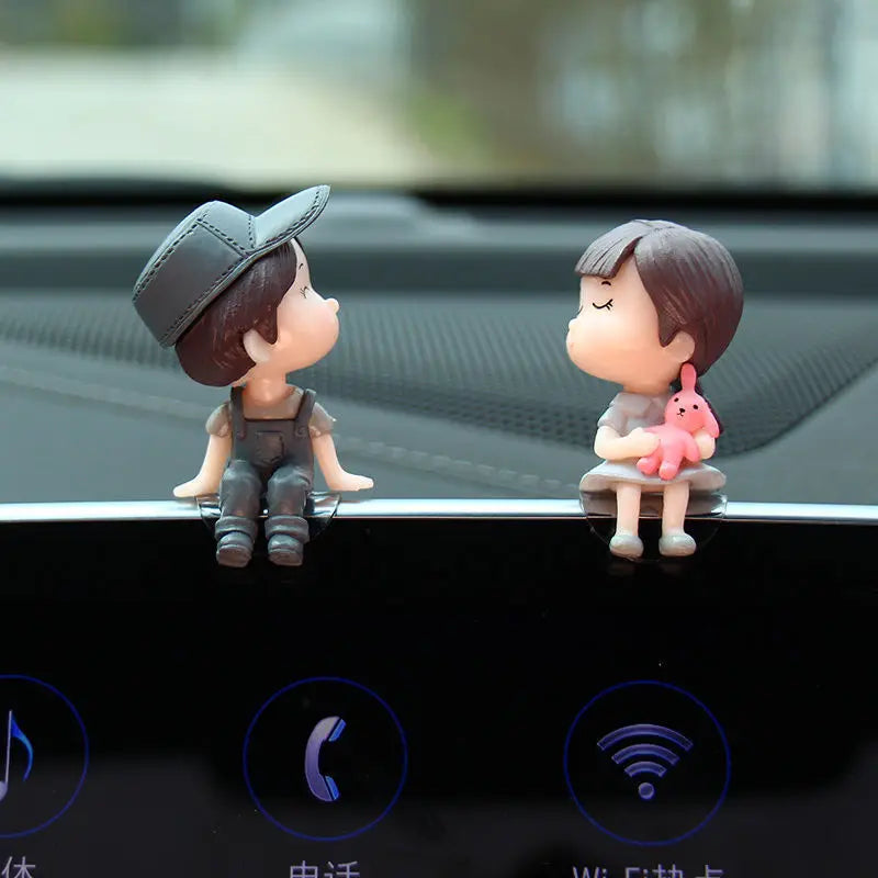 Cute cartoon couple car dashboard figurines from FanzyMarket, with romantic balloon ornament for car interior decoration.