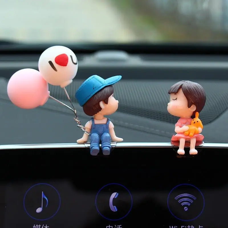 Cute cartoon couple car dashboard figurines with romantic balloon ornament, ideal for interior decoration and gifts.
