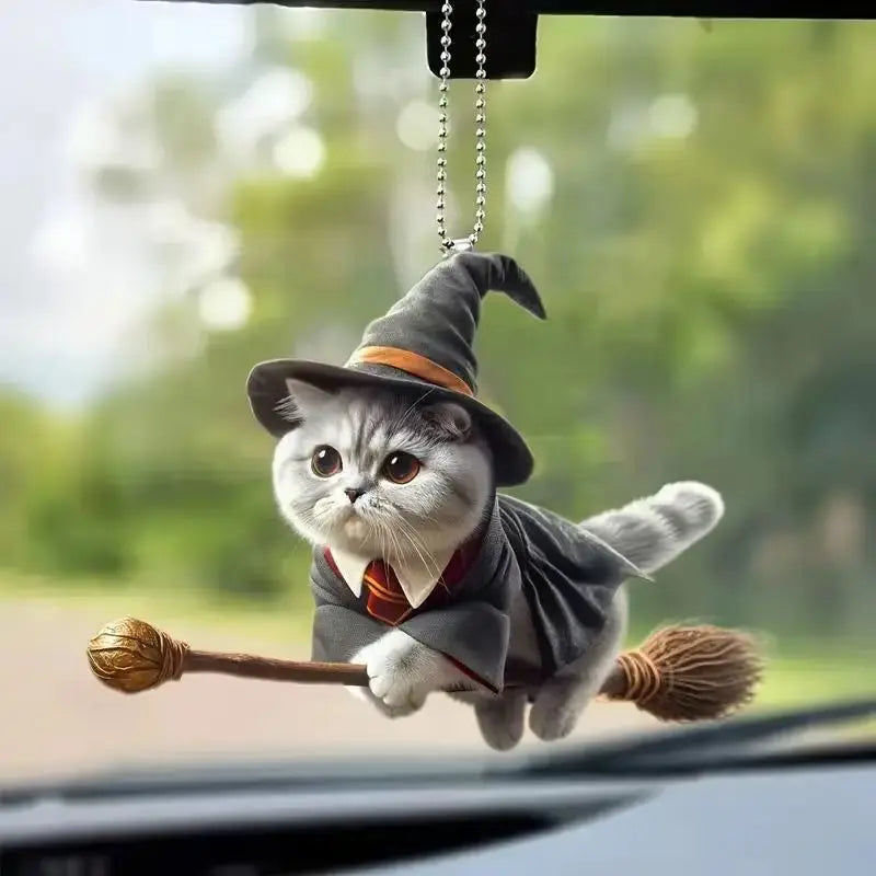 Cute cat-shaped rearview mirror ornament hanging inside a car, decorative interior accessory from FanzyMarket.