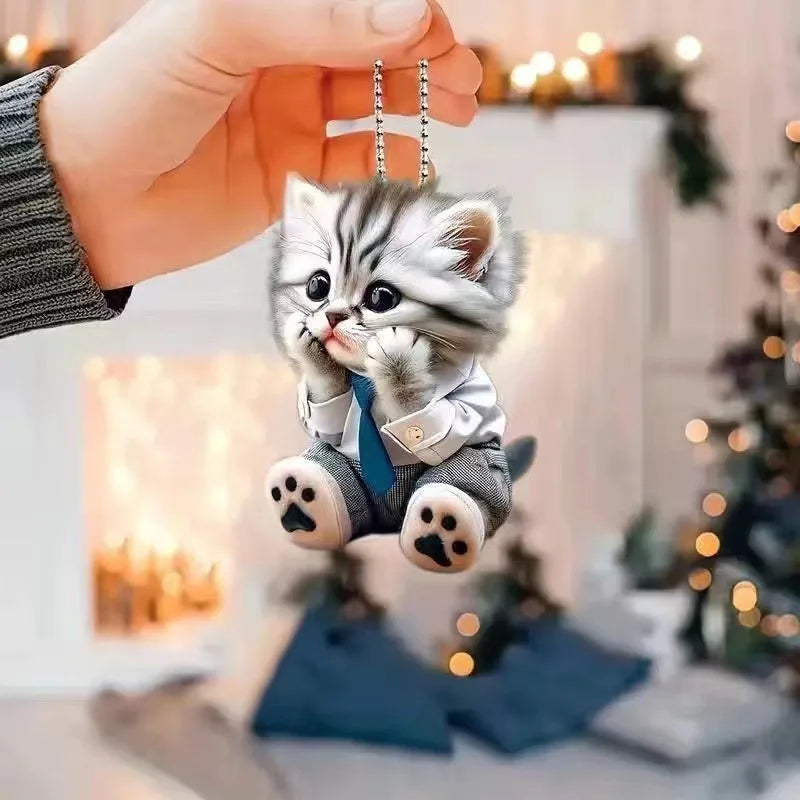 Cute cat-shaped rearview mirror ornament hanging inside a car, decorative pendant for vehicle interior decor.