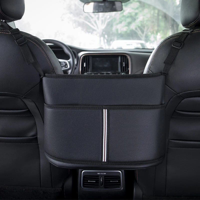 Leather car seat middle hanger organizer by FanzyMarket with large capacity, tissue and cup pockets for auto interior storage.