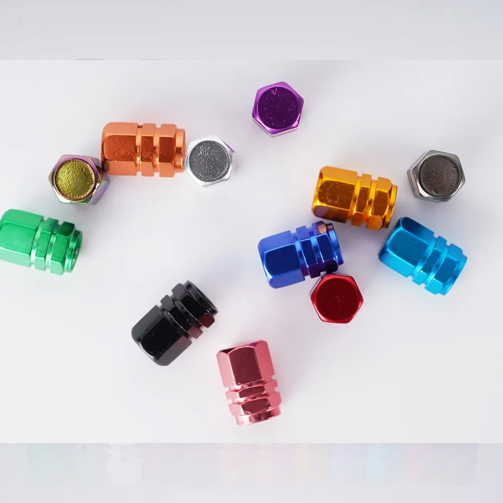 Red aluminum alloy tire valve stem caps for cars, motorcycles, and bicycles, dustproof and corrosion-resistant, 1.6 x 1.0 cm.