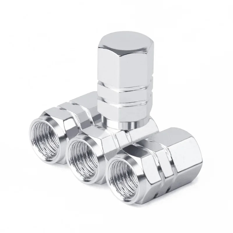 Red aluminum alloy tire valve stem caps for car, motorcycle, bicycle; dustproof and durable, 1.6 x 1.0 cm.