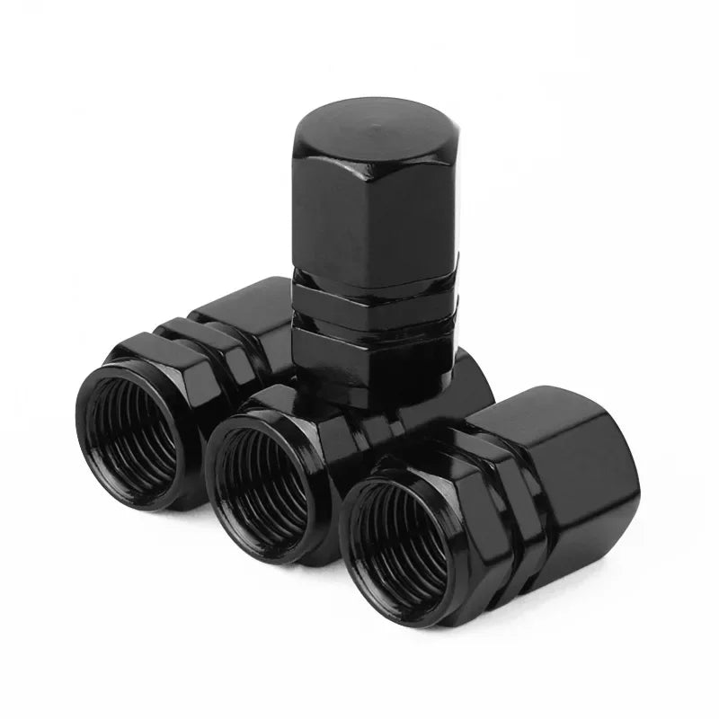 Red aluminum alloy tire valve stem caps for car, motorcycle, and bicycle, dustproof and rust-resistant for wheel protection.