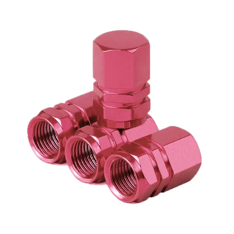 Red aluminum alloy tire valve stem caps for car, motorcycle, and bicycle wheels; dustproof and durable.