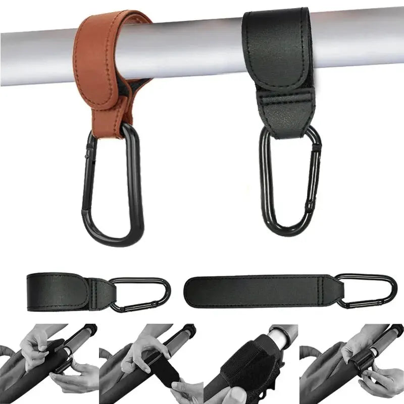 Two pink PU leather stroller hooks by FanzyMarket, adjustable pram bag hangers for diaper bags and nursery organization.