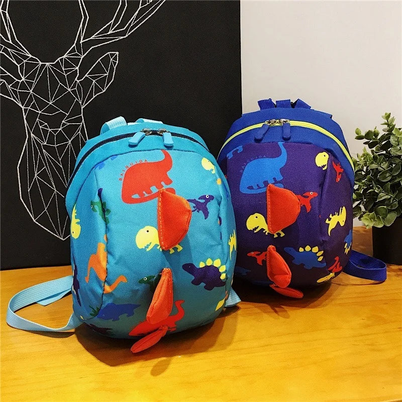 Green toddler dinosaur safety harness backpack with a detachable leash, designed for preschool kids to prevent loss and enhance safety.