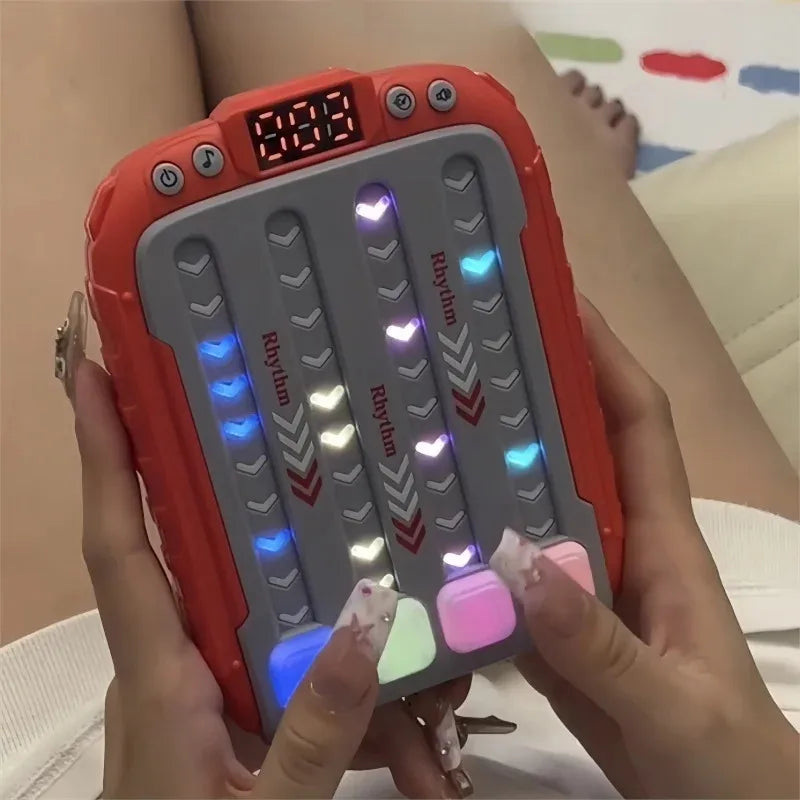 FanzyMarket electronic rhythm push game toy for babies, light-up Montessori travel puzzle with sensory and educational features.
