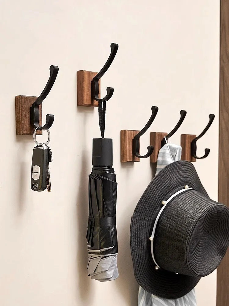 Wall-mounted aluminum robe hook by FanzyMarket with black walnut finish, holds towels, coats, and bags, available in 1-3 hook options.