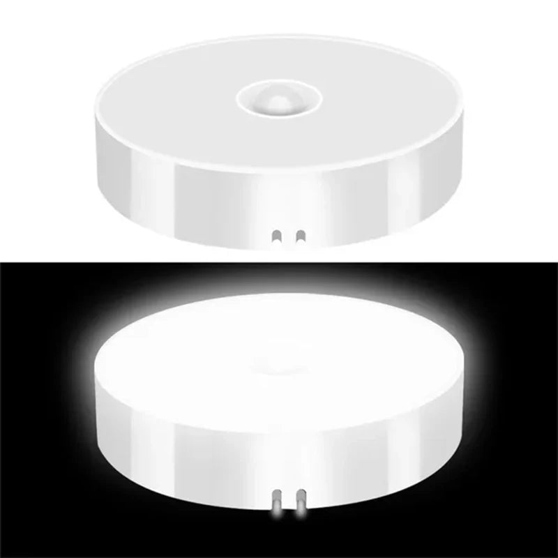 Two white PIR motion sensor LED night lights from FanzyMarket, rechargeable, wireless heart-shaped lights for closet, cabinet, and staircase.