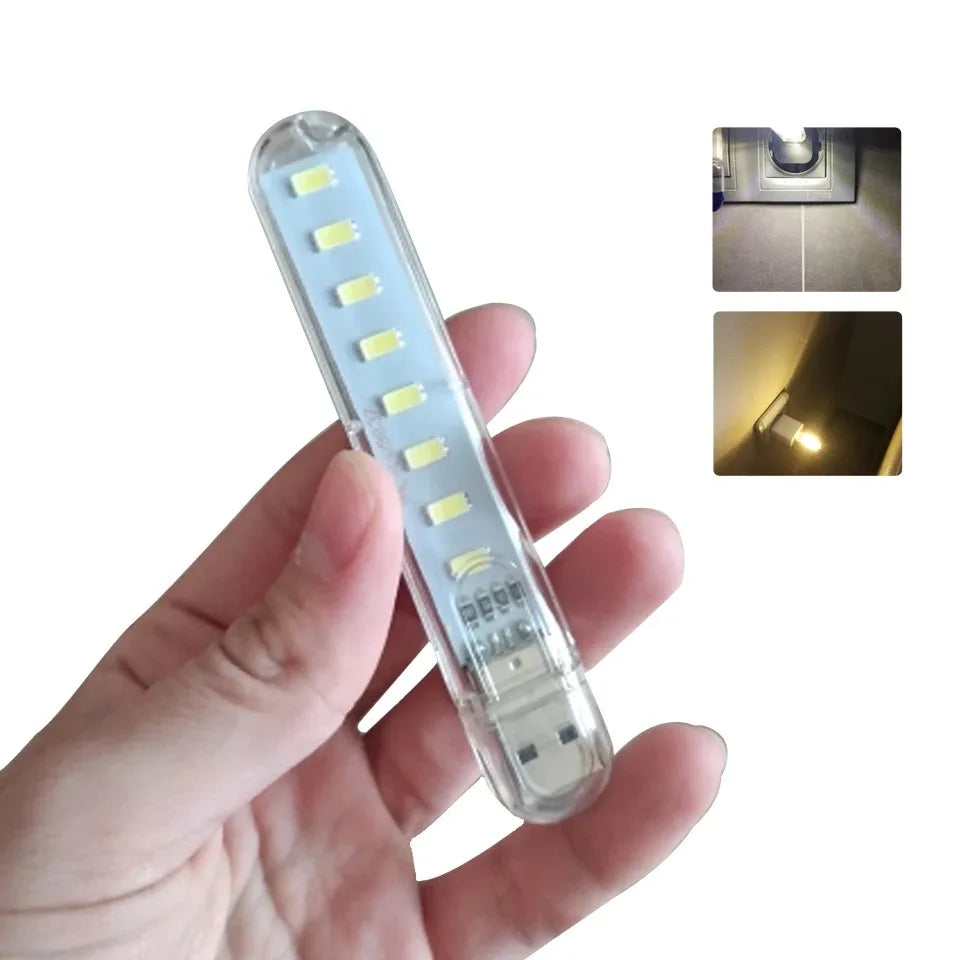 FanzyMarket mini USB LED book light with 8 LEDs, warm white, portable, ideal for reading on power banks, laptops, or notebooks.