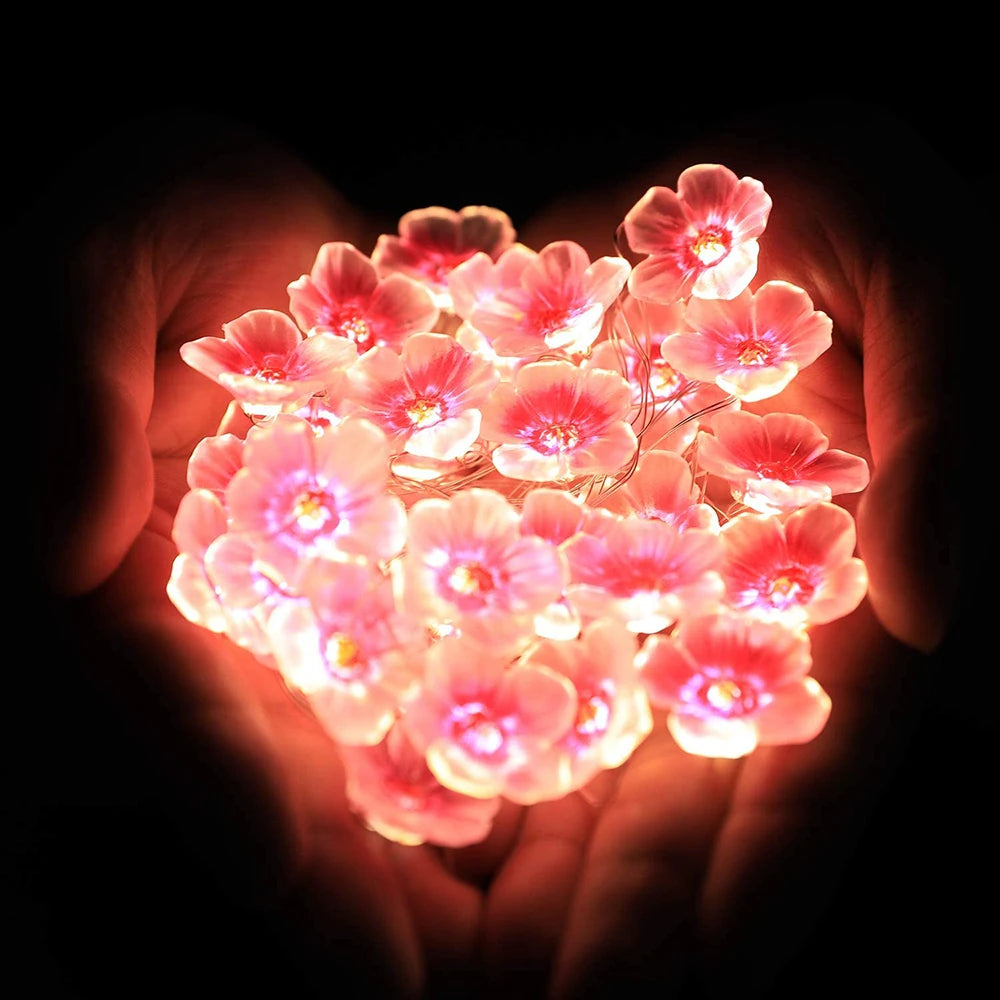Pink cherry blossom fairy string lights with 30 LEDs, battery-powered floral garland for home, bedroom, and Christmas decor.
