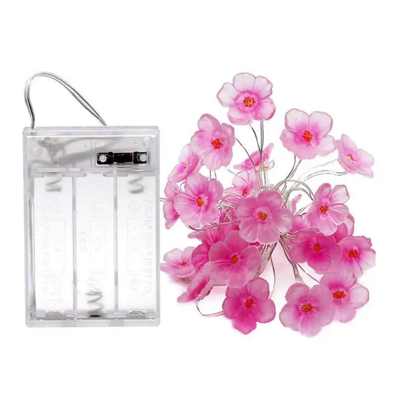 FanzyMarket 30 LED pink cherry blossom fairy string lights, battery-powered flower garland for home, bedroom, and Christmas decor.