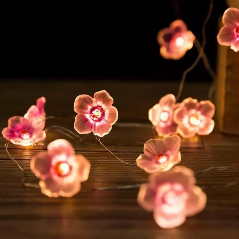 FanzyMarket 30 LED pink cherry blossom fairy string lights with battery pack, ideal for home, bedroom, and Christmas decor.