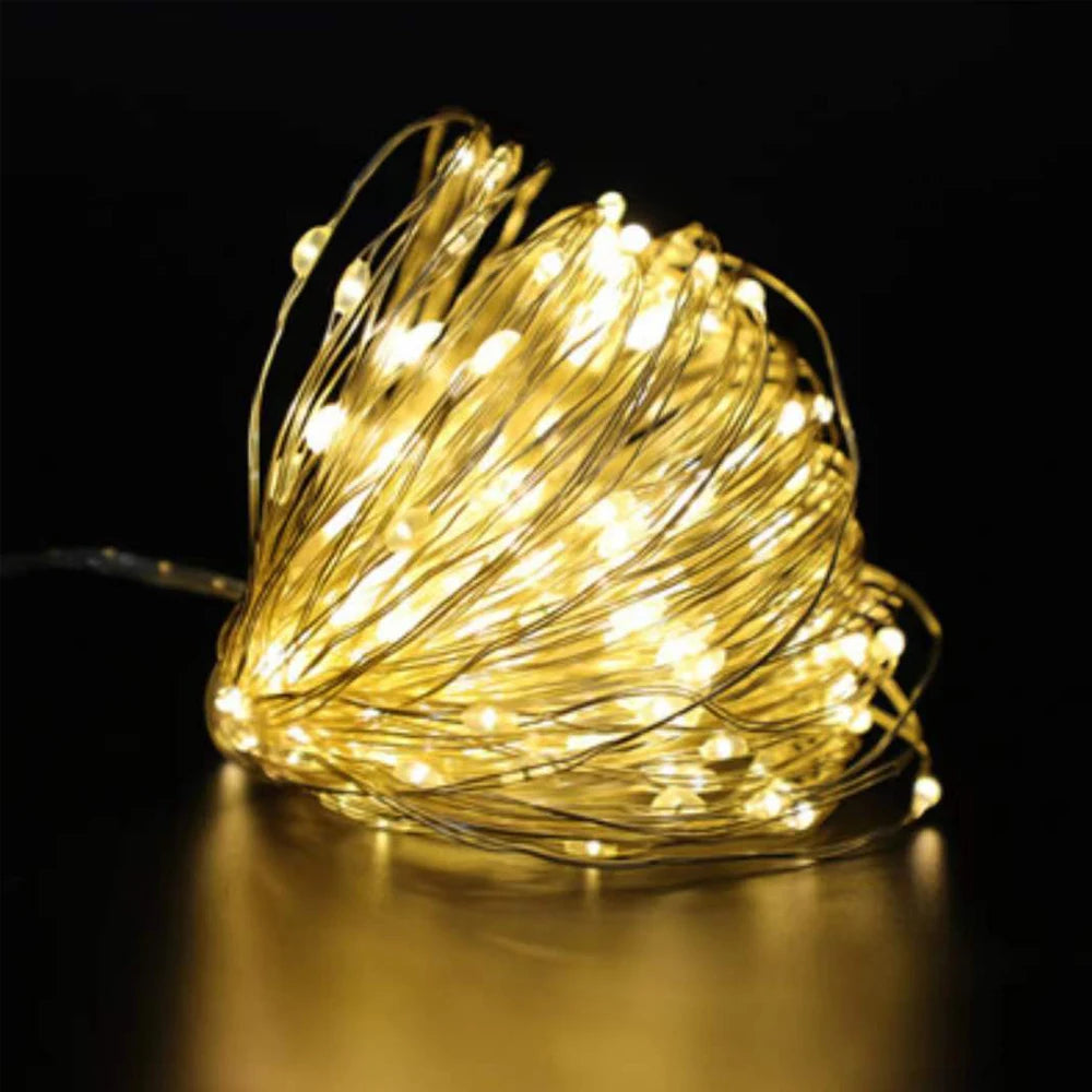 Waterproof battery-operated LED copper wire fairy lights in white, 2m length, ideal for wedding, party, Christmas, or DIY decor.