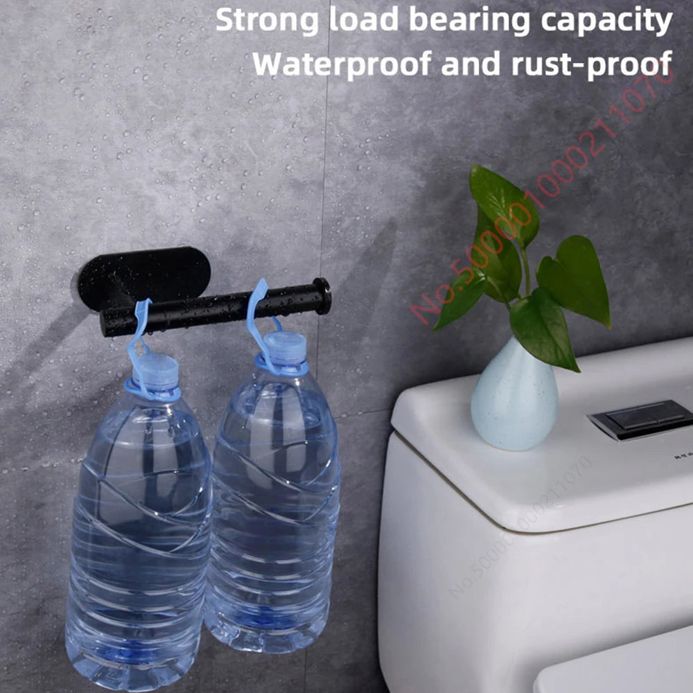 Two black stainless steel no-drill toilet paper and paper towel holders with adhesive wall mounts for bathroom and kitchen.