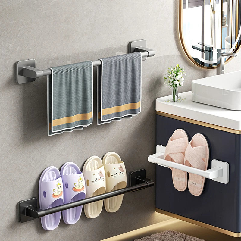 Gray self-adhesive double towel bar from FanzyMarket, no-drill bathroom towel rack with two bars in white and gray.
