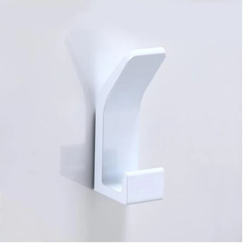 Polished silver stainless steel bathroom hardware set with towel rack, toilet paper holder, and hook for modern bathroom decor.