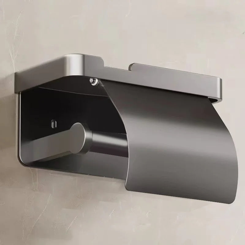 FanzyMarket no-drill aluminum toilet paper holder wall-mounted in black, rust-resistant bathroom accessory with adhesive or screw mounting.