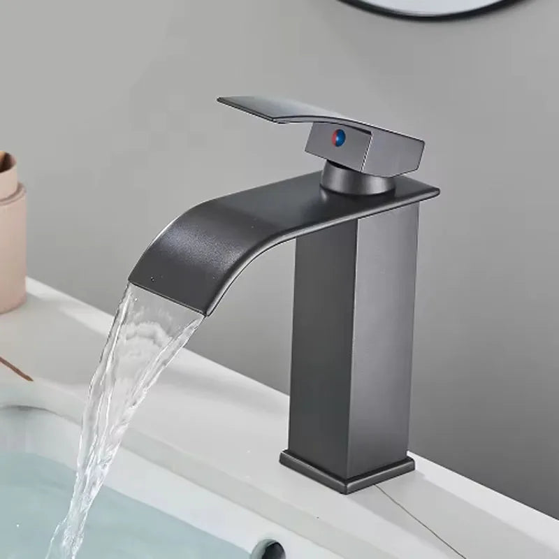Brushed gold waterfall bathroom faucet by FanzyMarket with single lever, deck-mount basin mixer, stainless steel ceramic valve, single hole.