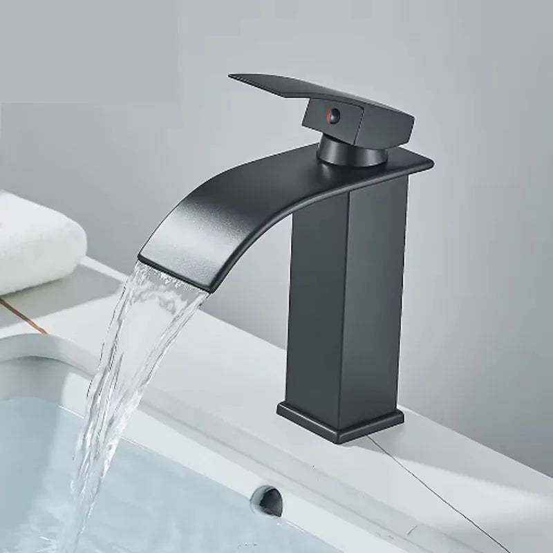 Brushed gold waterfall bathroom faucet by FanzyMarket, single lever deck-mount basin mixer with ceramic valve and single hole installation.