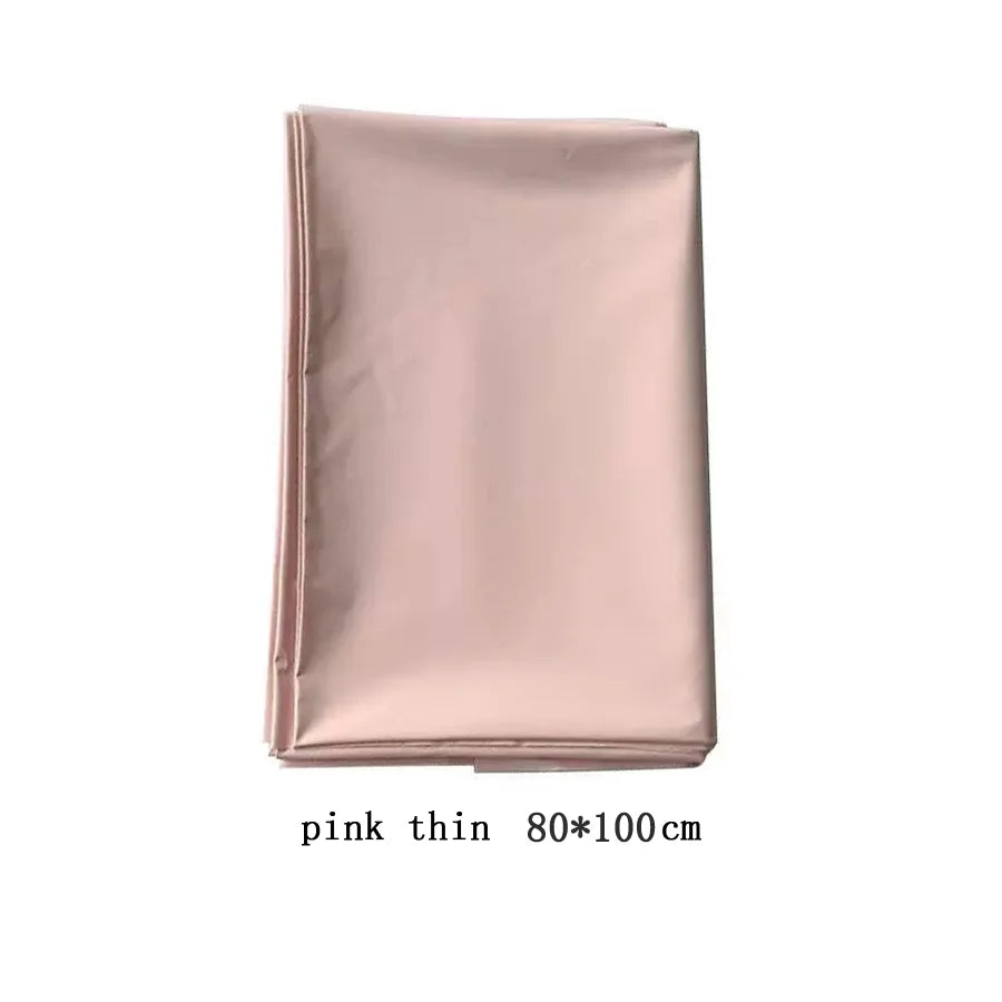 Pink waterproof PVC bed sheet coverlet from FanzyMarket, oil and spa protector for couples, fits large beds, available in three colors.