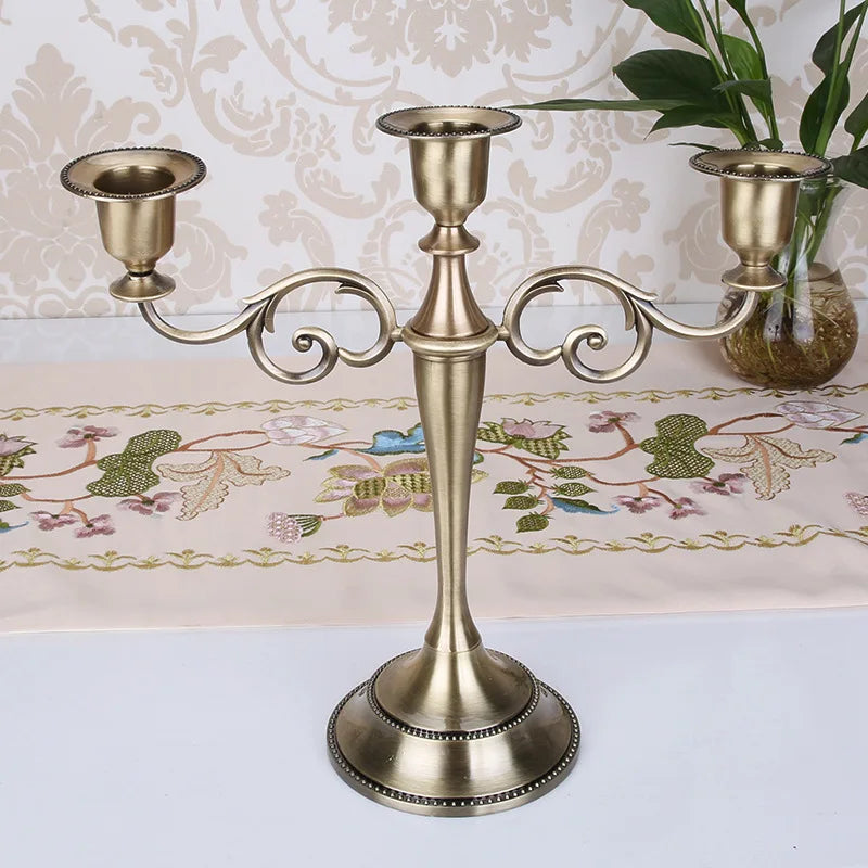 FanzyMarket 3-arm metal candelabra in silver, gold, black, and bronze with a retro design, 10.8 inches tall, for wedding and home decor.