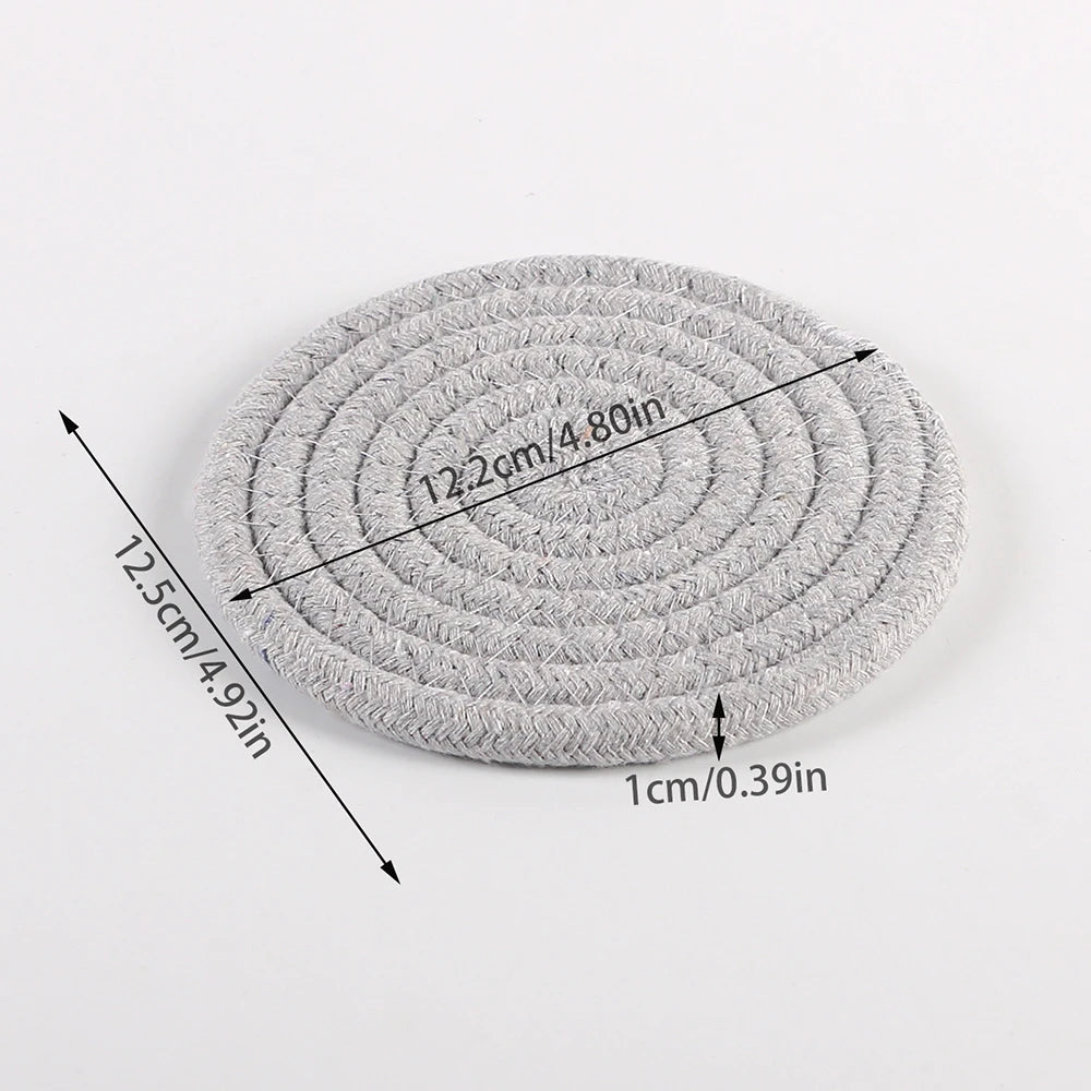 Woven cotton-linen drink coaster by FanzyMarket, heat-resistant and absorbent cup mat for protecting tabletops in kitchen and dining areas.