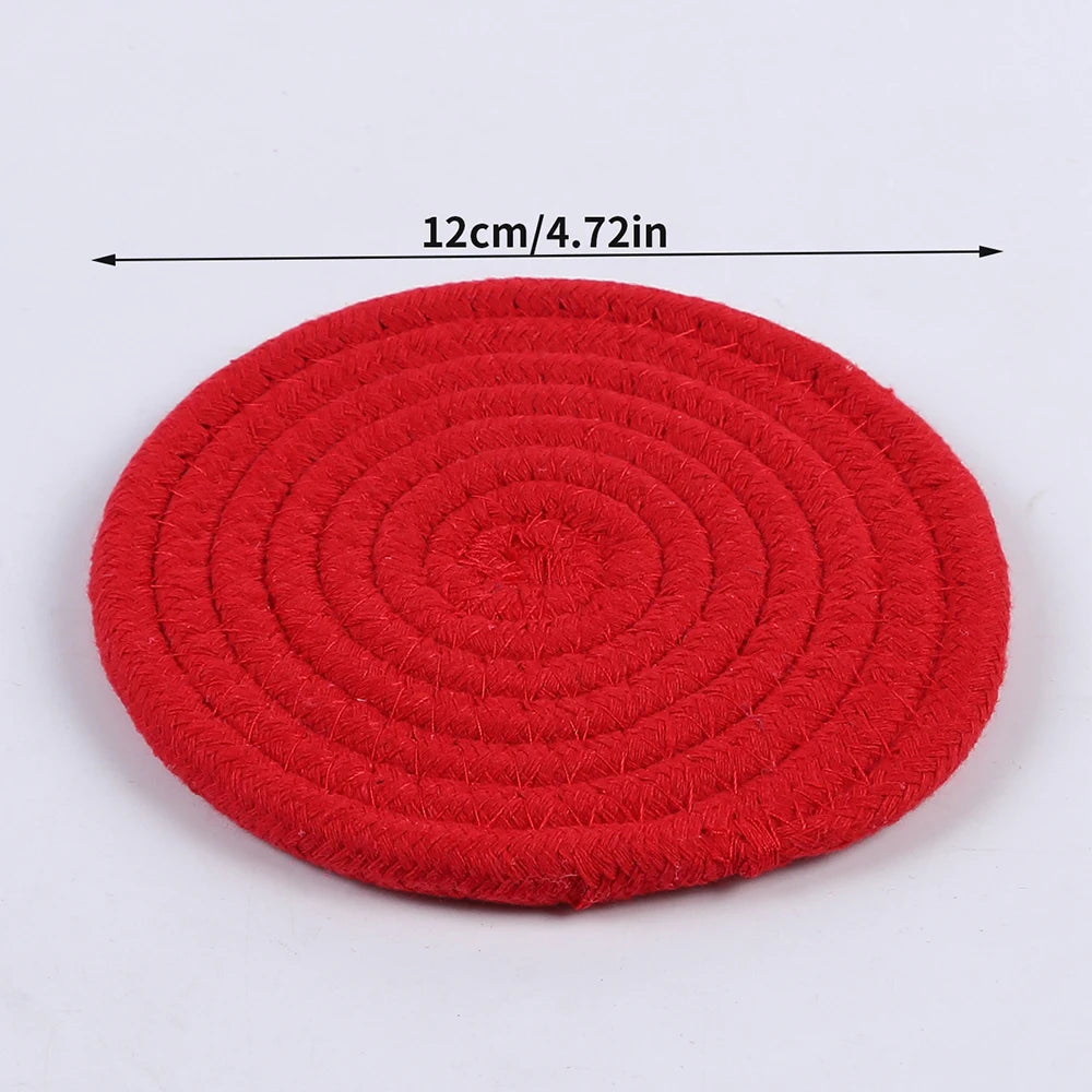 Woven cotton-linen drink coaster by FanzyMarket, heat-resistant and absorbent cup mat for tabletop protection.