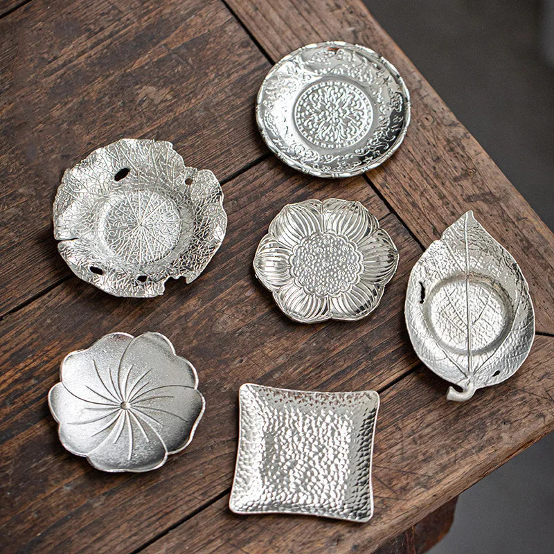 FanzyMarket metal round drink coaster for cups and glasses, modern silver table accessory for kitchen and dining use.