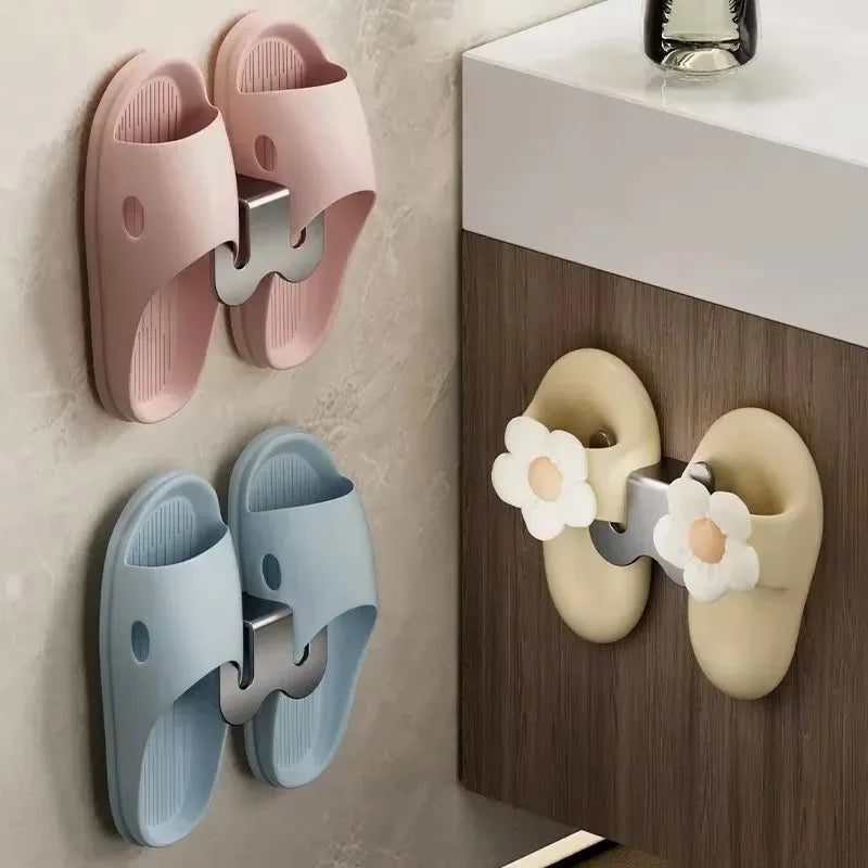 Black wall-mounted bathroom slipper rack with rear drainage and single-tier shoe storage hook by FanzyMarket, ideal for home organization.