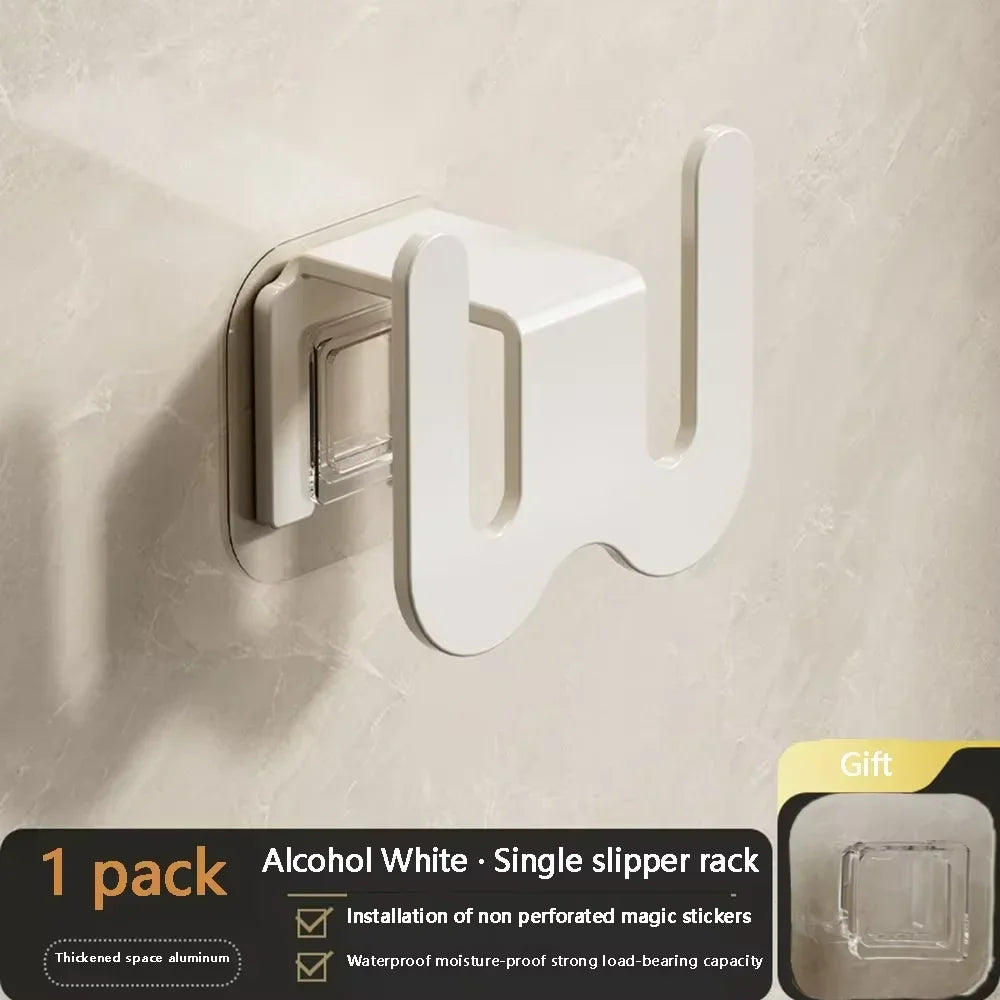 Black wall-mounted bathroom slipper rack with rear drainage and single-tier shoe storage hook for organized home and garden use.