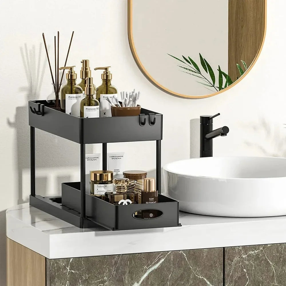 Black 2-tier under-sink sliding cabinet organizer by FanzyMarket with hooks and hanging cup for bathroom and kitchen storage.