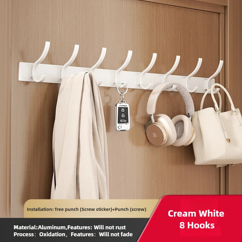 FanzyMarket black and white 6-peg folding wall hooks made of aluminum, mounted for towels or coats in home organization.