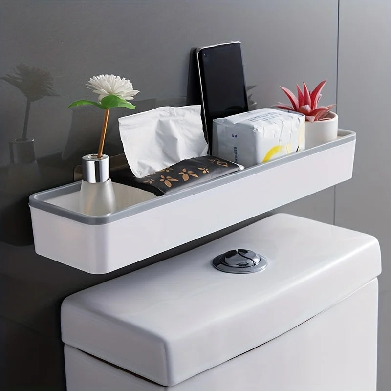 White over-toilet wall shelf organizer by FanzyMarket, adhesive no-drill corner bathroom storage rack on bathroom wall.