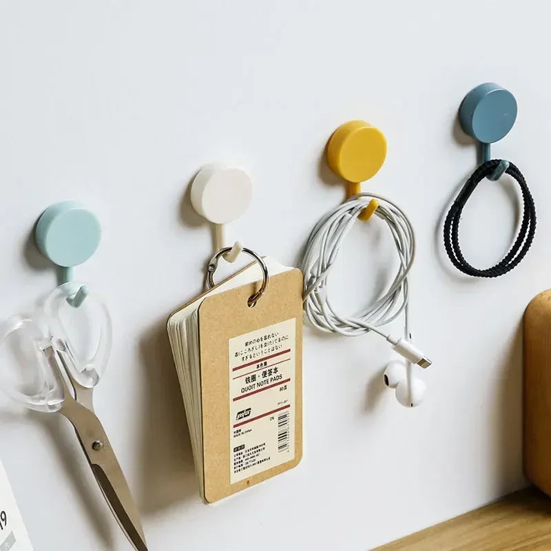 FanzyMarket 10-pack self-adhesive wall hooks for bathroom and kitchen, strong plastic coat towel hangers, no drill needed.